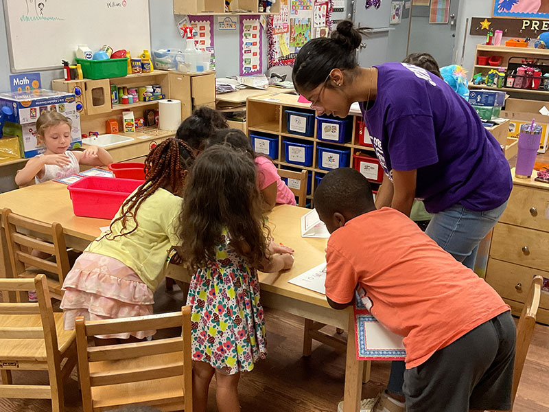 Precious Angels intern with children